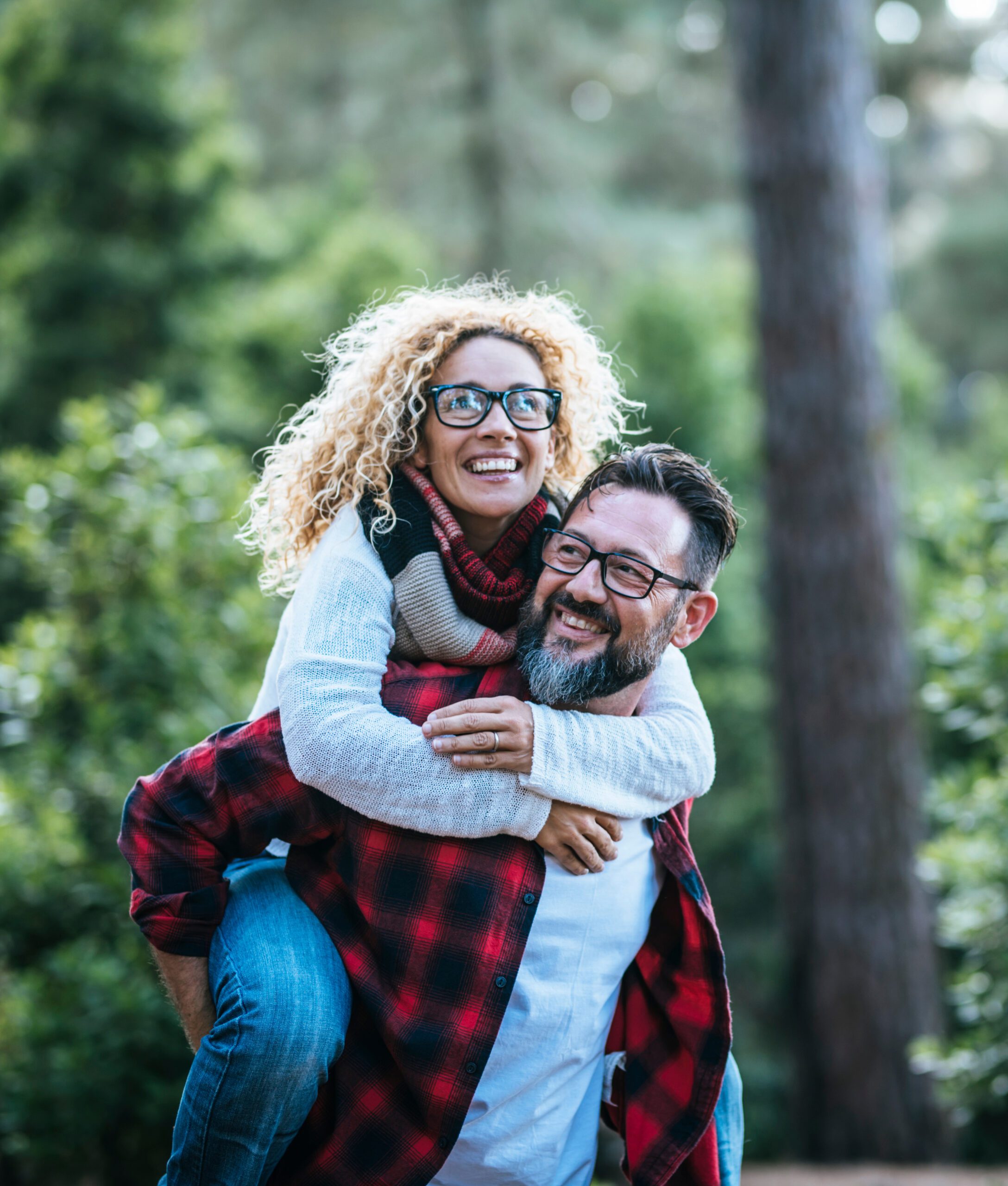 a happy middle aged couple in the wilderness